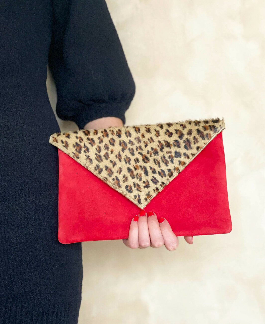 Red velvet and leopard clutch bag